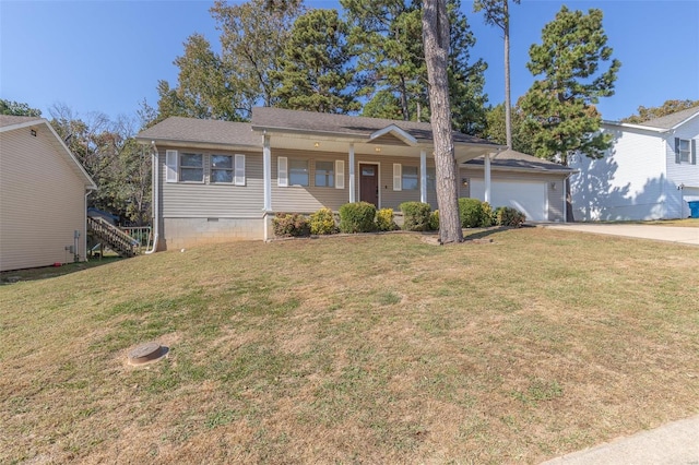 view of front of property featuring a front yard and a garage