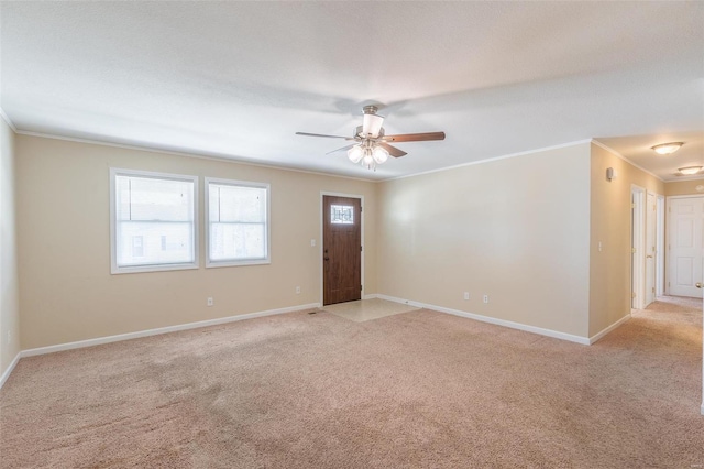 unfurnished room with light carpet, ornamental molding, and ceiling fan