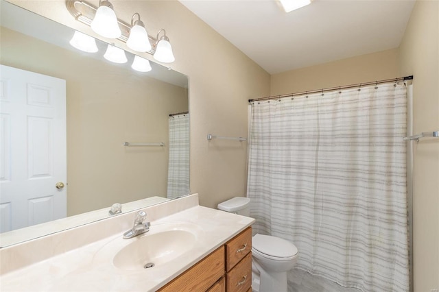 bathroom with vanity, a shower with curtain, and toilet