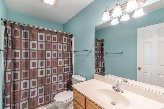 bathroom featuring toilet, vanity, and a shower with shower curtain