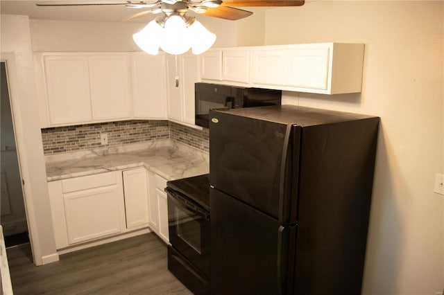 kitchen with white cabinets, tasteful backsplash, refrigerator, dark wood-type flooring, and black electric range