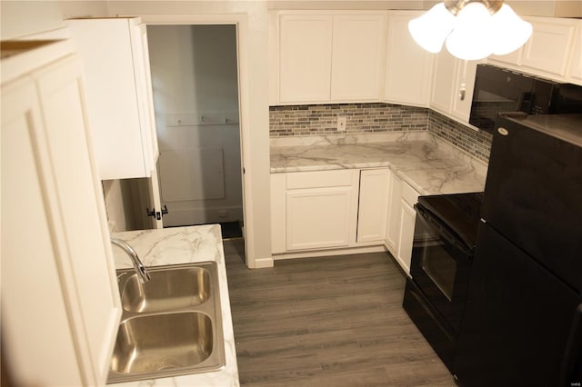 kitchen with dark wood-type flooring, sink, black appliances, light stone countertops, and white cabinets