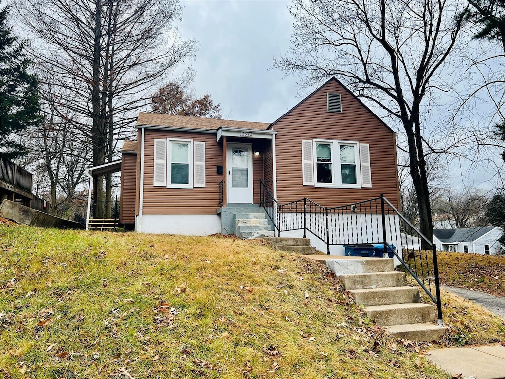 view of front of home with a front yard