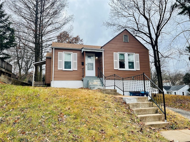 view of front of home with a front yard