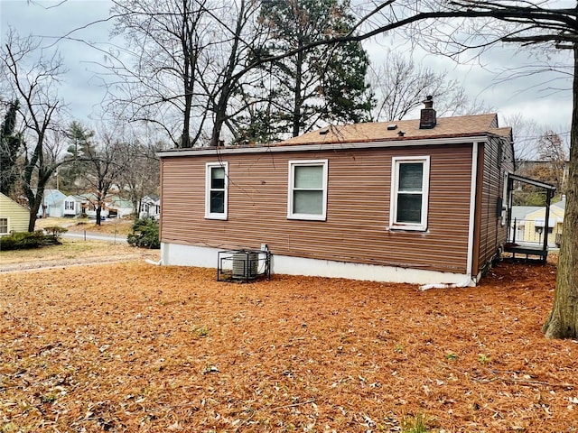 view of side of home featuring central air condition unit