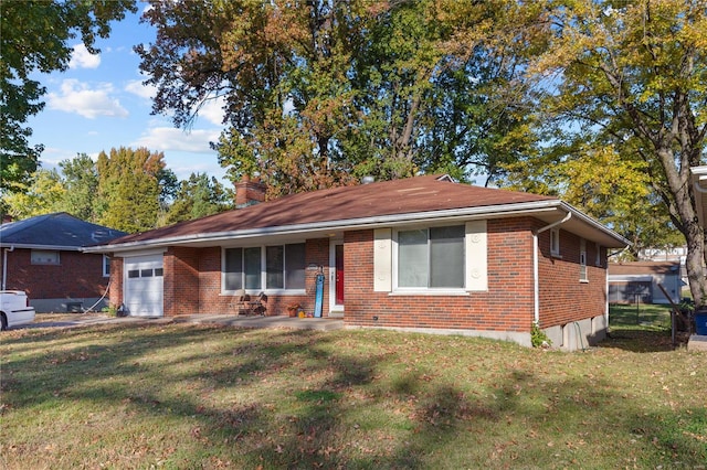 single story home with a front yard and a garage