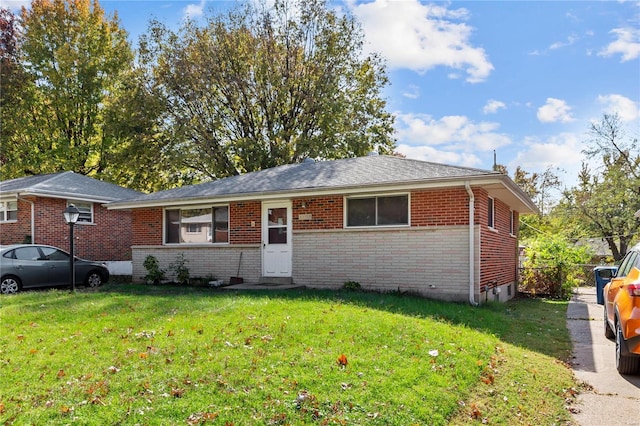 ranch-style home with a front yard