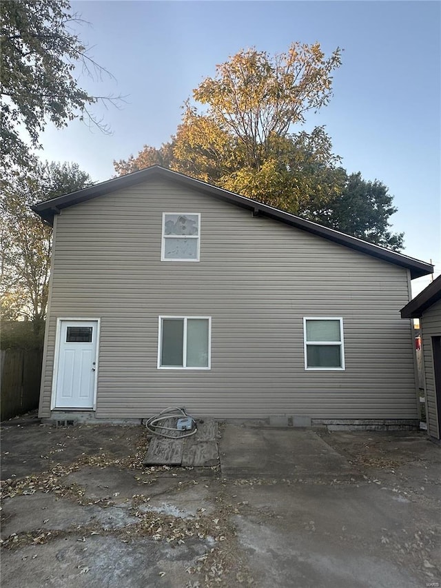 rear view of property featuring a patio