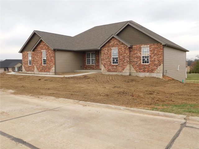 view of front of house with brick siding