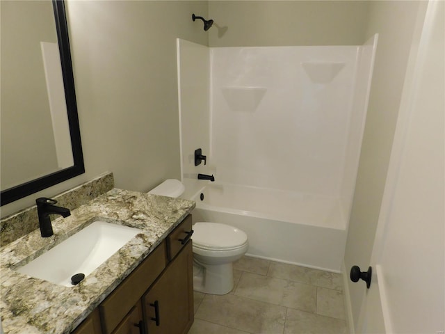 bathroom featuring tile patterned floors, bathing tub / shower combination, toilet, and vanity