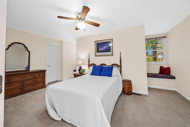 bedroom featuring light colored carpet and ceiling fan