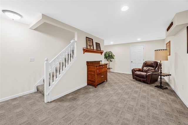 living area with light colored carpet