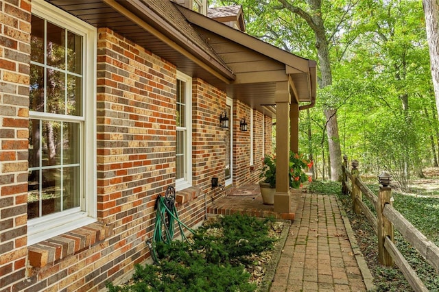 view of property exterior featuring a porch