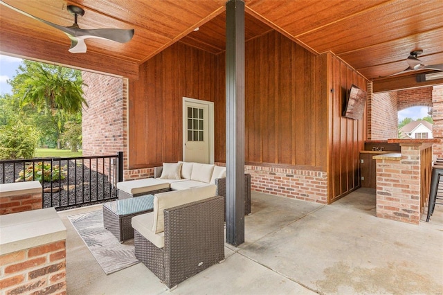 view of patio with outdoor lounge area and ceiling fan