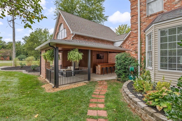 exterior space with a patio and a yard