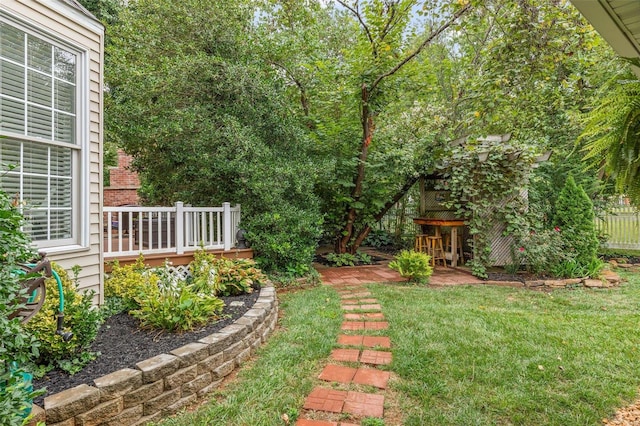 view of yard featuring a wooden deck