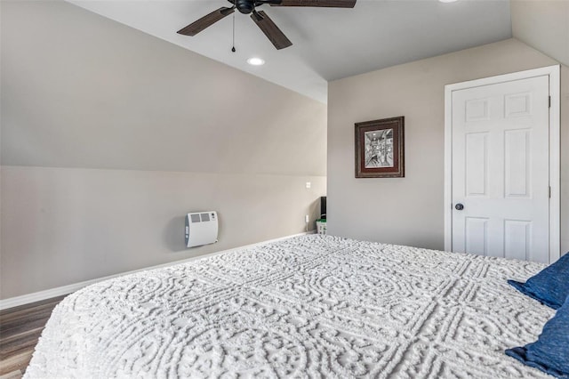 bedroom with vaulted ceiling, dark hardwood / wood-style floors, and ceiling fan