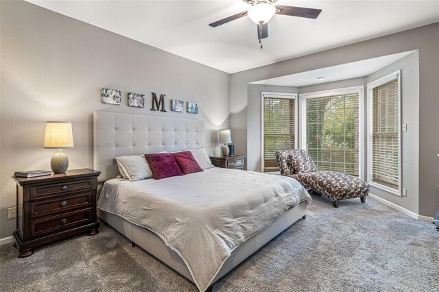 carpeted bedroom featuring ceiling fan