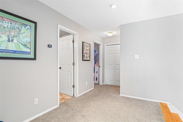 hallway with light carpet