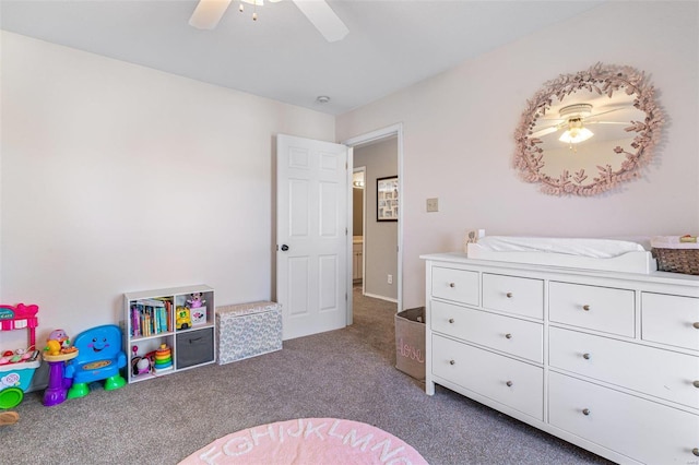 interior space featuring dark carpet and ceiling fan