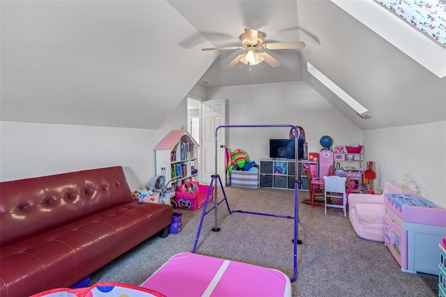 rec room featuring vaulted ceiling with skylight, carpet, and ceiling fan