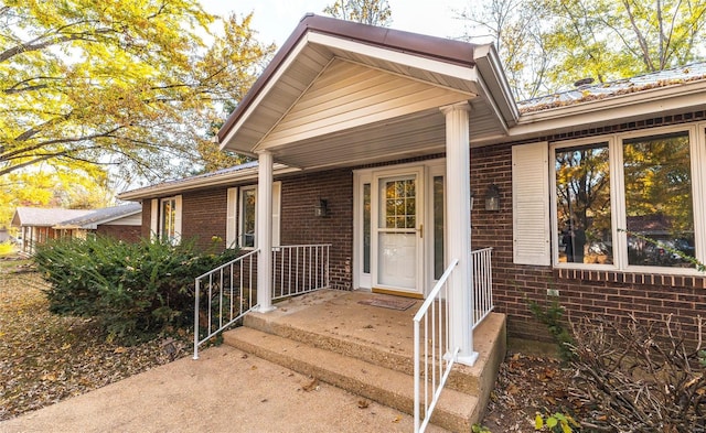 property entrance with covered porch