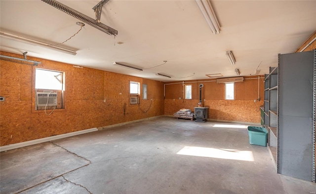 basement featuring cooling unit and plenty of natural light