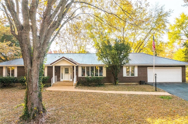 ranch-style house featuring a garage