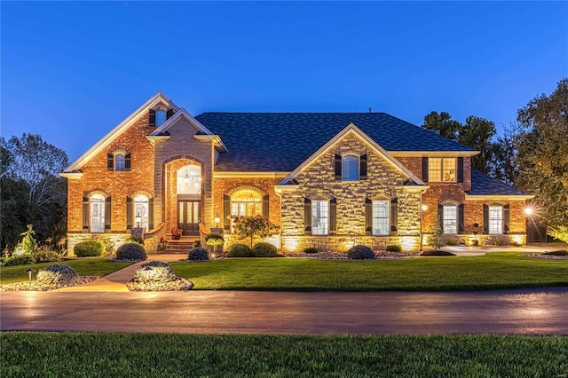 view of front of home with a yard