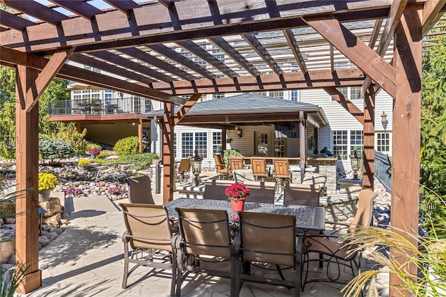 view of patio / terrace featuring exterior bar and a pergola