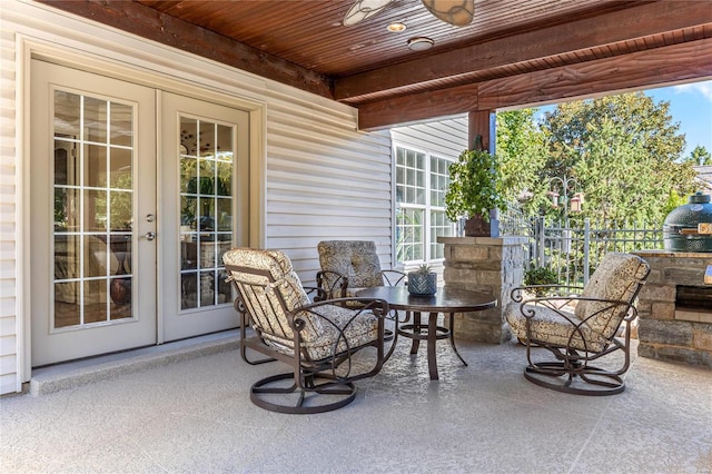 view of patio with french doors and ceiling fan