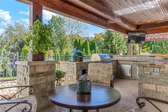 view of patio with area for grilling and exterior kitchen