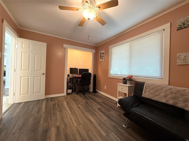 home office featuring ceiling fan, dark wood-type flooring, and ornamental molding