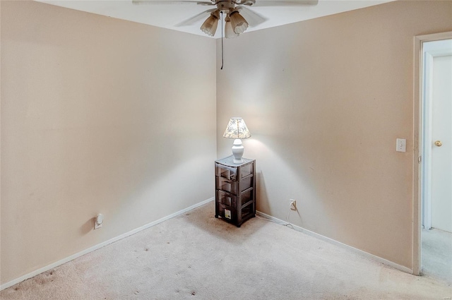 unfurnished room with light carpet and ceiling fan