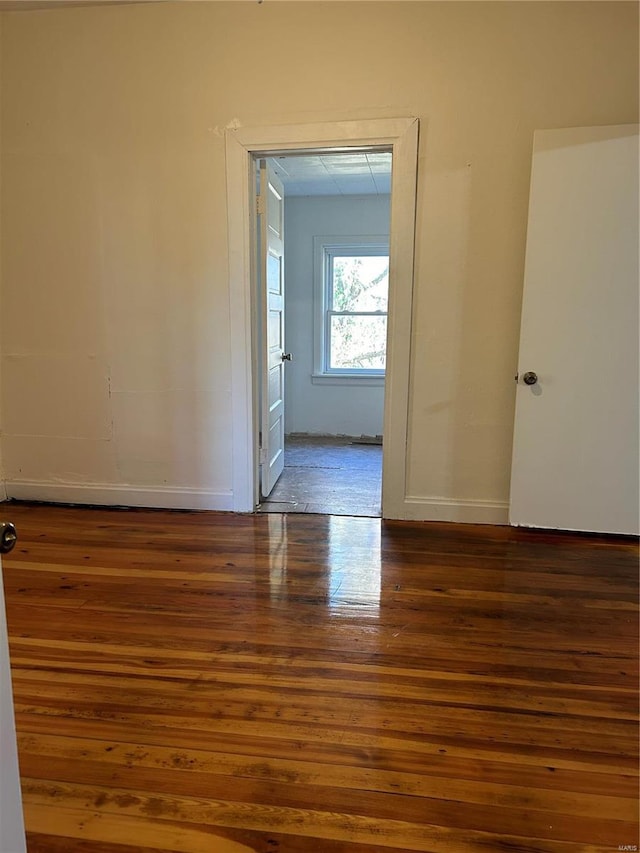 spare room with dark hardwood / wood-style floors