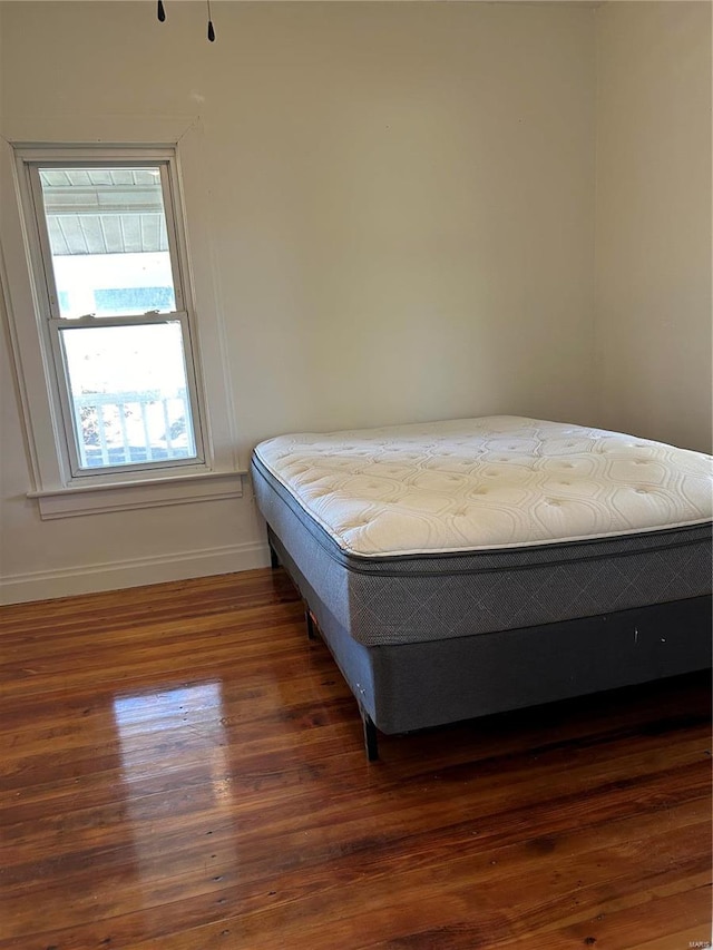 bedroom featuring dark hardwood / wood-style floors