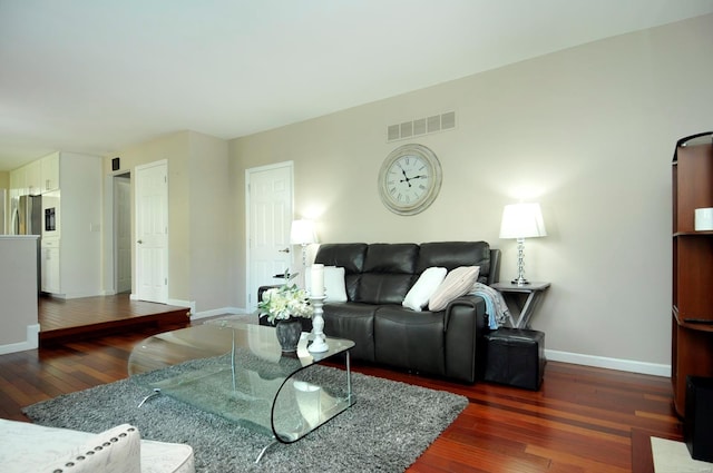 living room featuring dark hardwood / wood-style floors