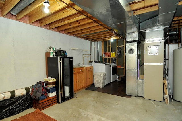 basement with heating unit, water heater, and black fridge