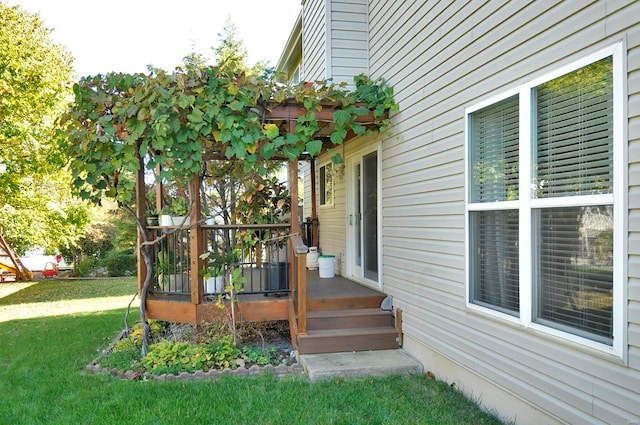 exterior space featuring a wooden deck and a yard