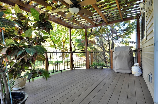 wooden terrace featuring a pergola and ceiling fan