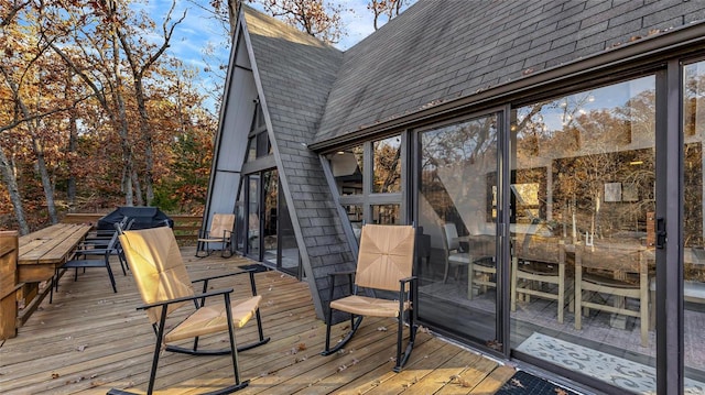 wooden deck featuring grilling area