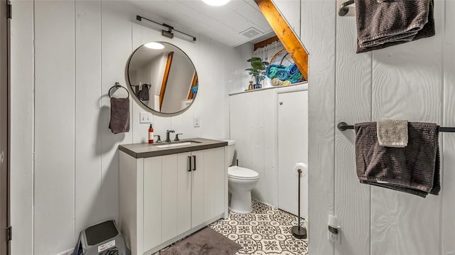 bathroom with toilet and vanity