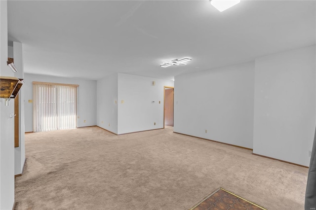 empty room with light colored carpet