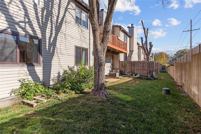 view of yard with a balcony