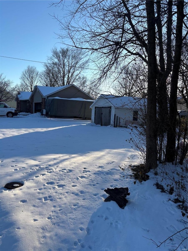 view of yard covered in snow