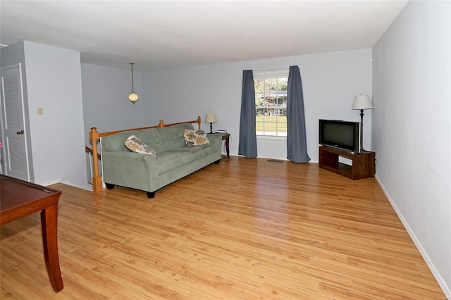 living room with light hardwood / wood-style flooring