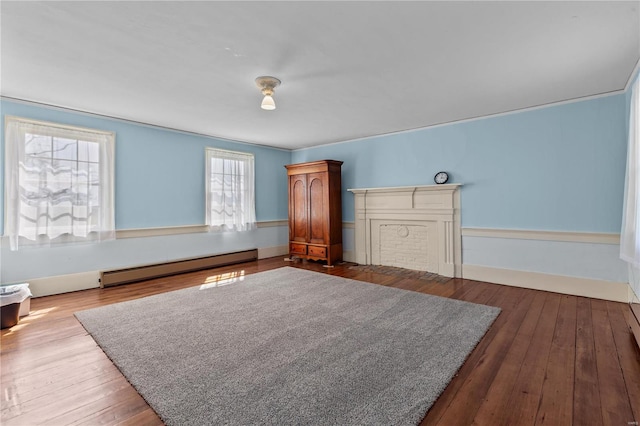 interior space with hardwood / wood-style floors and baseboard heating