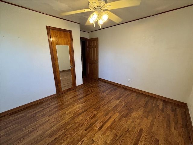 unfurnished bedroom with dark wood-type flooring and ceiling fan