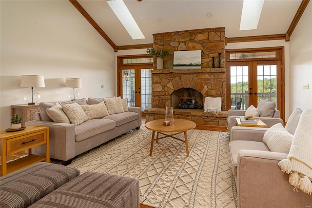 living room with high vaulted ceiling, french doors, a fireplace, and light wood-type flooring