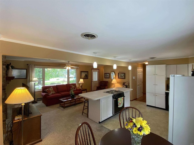 kitchen with a center island, light carpet, white cabinets, black / electric stove, and white refrigerator